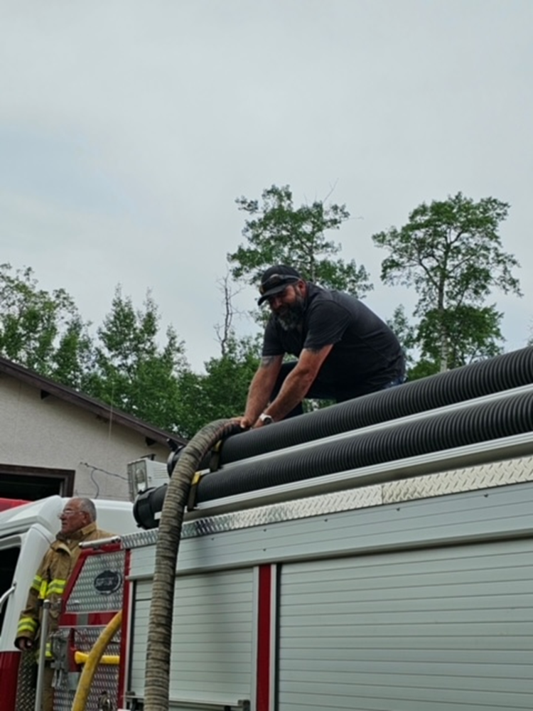 crews from Nadleh-Macro respond to a residential home on fire